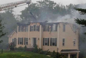 Three dead after plane crashes into US home